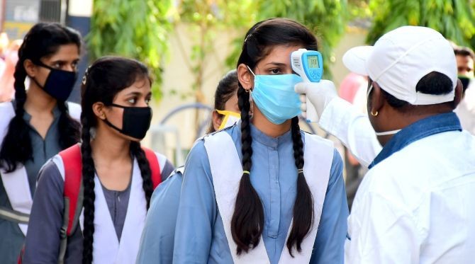 Students undergo thermal screening before appearing for the Madhya Pradesh Board of Secondary Education's higher secondary school examination in Jabalpur. ANI Photo.